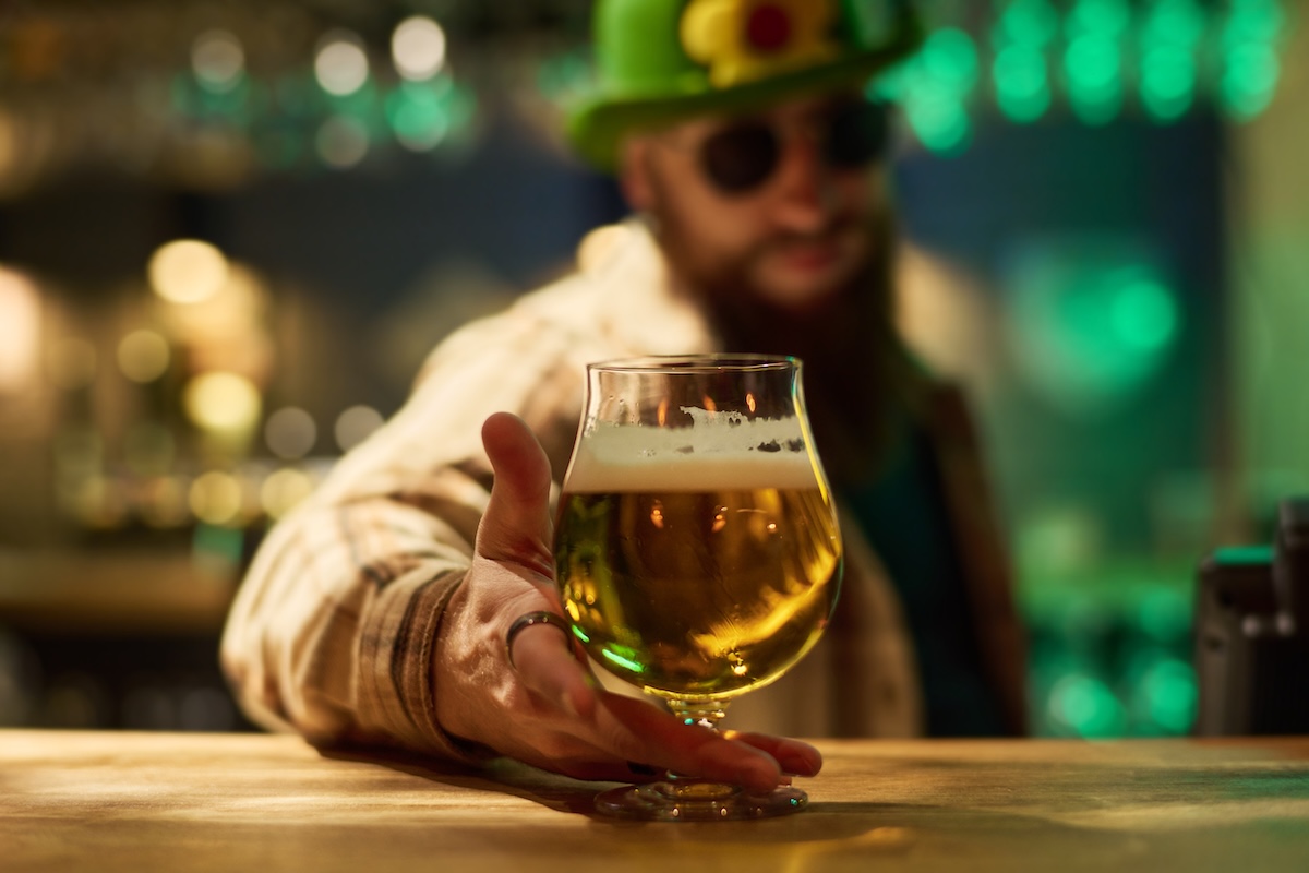 bar_st_patricks_day_beer_by_pressmaster_ID_208984325_m - DiningOut Focus on hand of bearded barman in green hat and checkered shirt putting glass of cool foaming beer on wooden counter in pub
By: pressmaster
ID: 208984325