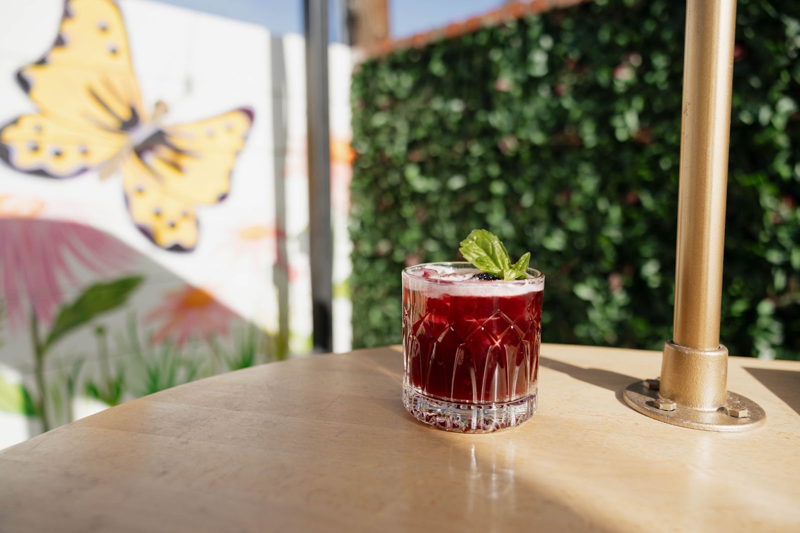 Sip drink specials on Wonderyard’s aesthetic patio | Photo by Wonderyard Garden + Table