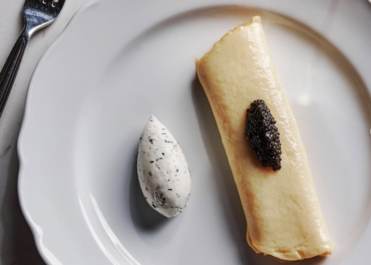Caviar-topped French omelette and a quenelle of chive crème fraîche at Lucian Books and Wine. | Photo by Lucian Books and Wine