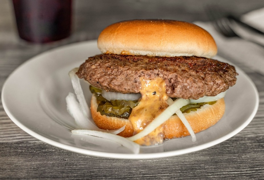 The Juicy Lucy looks bigger than it is, thanks to the gooey cheese stuffed inside. | Photo courtesy of Lucy's Burger Bar