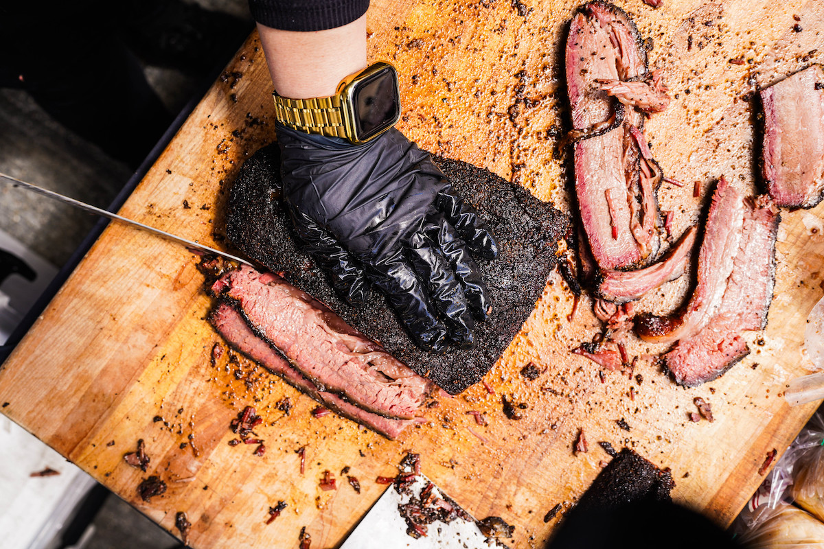 Attendees get an up close look at all of the smoked meat action at the Houston BBQ Festival. | Photo by Robert Lerma