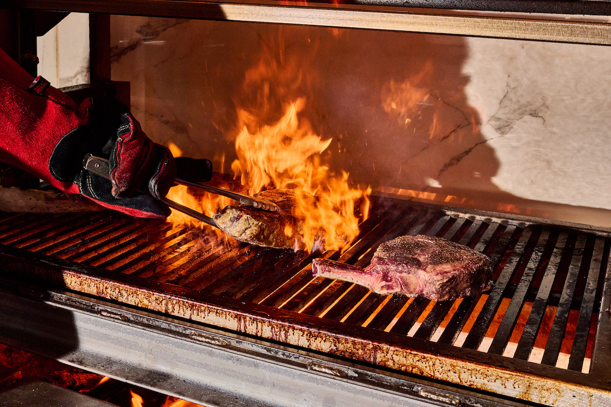 The menu at Clark's Steakhouse is rooted in live-fire cooking. | Photo by Angie Webb