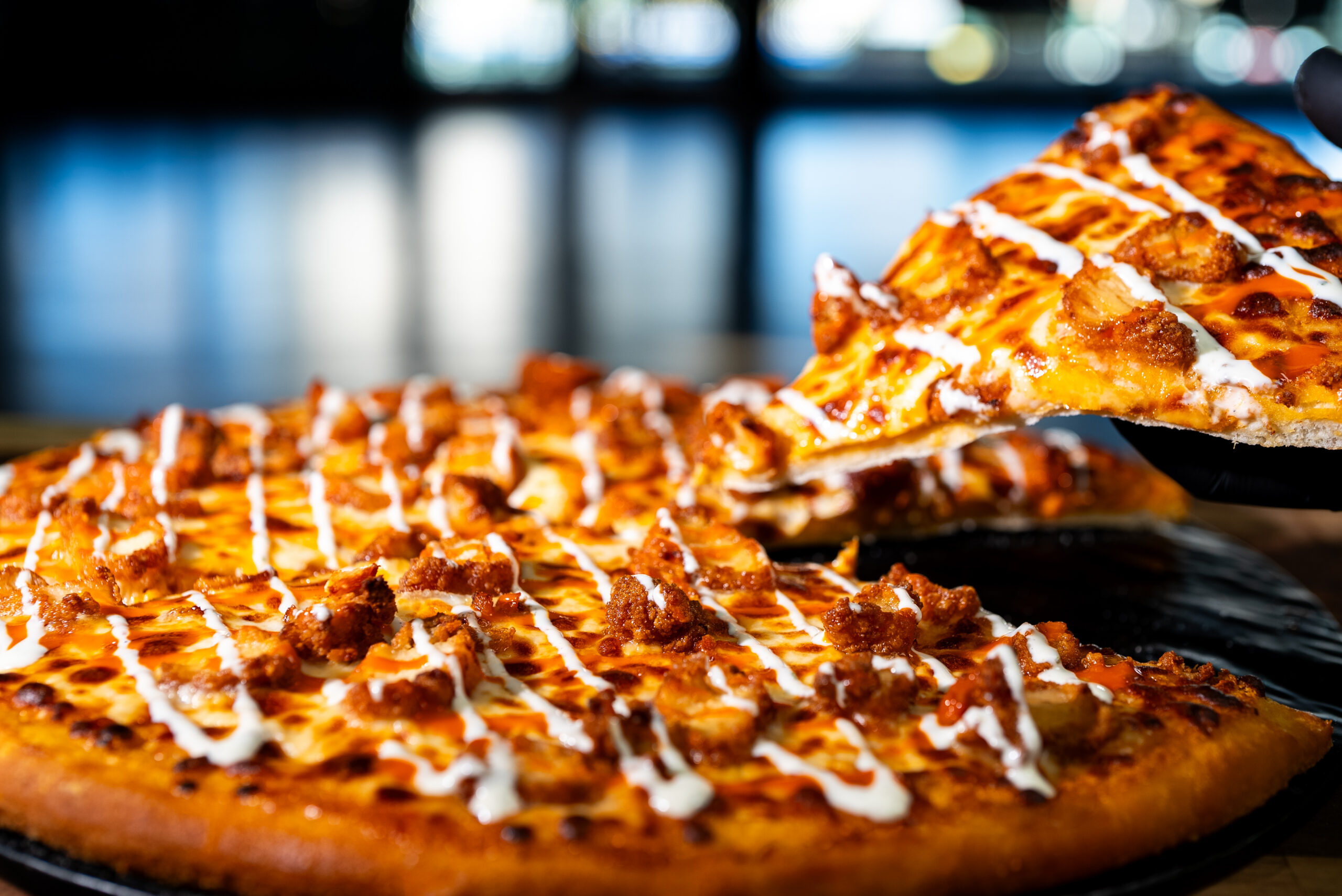 Buffalo chicken pizza at Crust City Pizza inside Daikin Park. | Photo by Aramark Sports + Entertainment