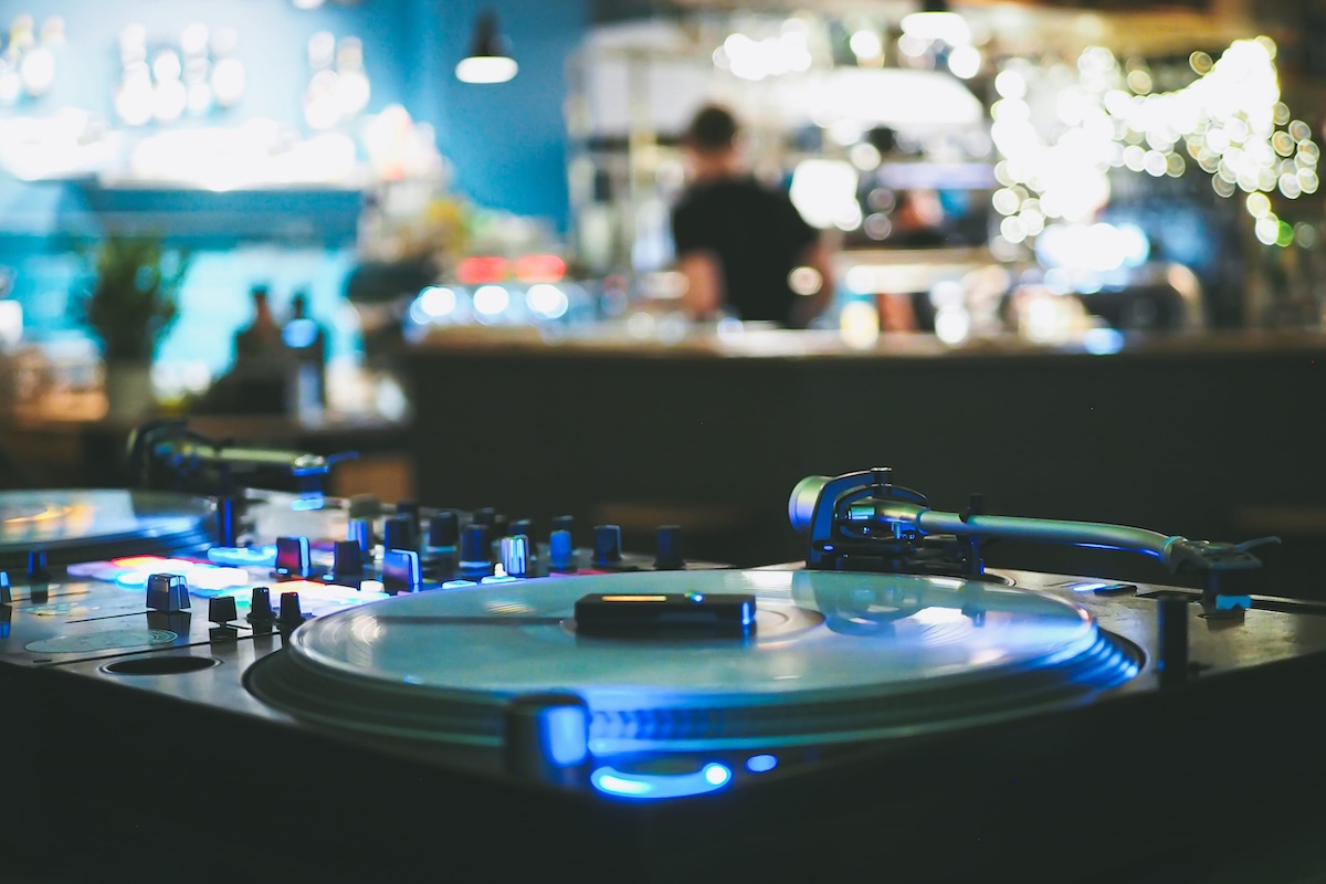 DJ vinyl players in dark nightclub, party in the dance club