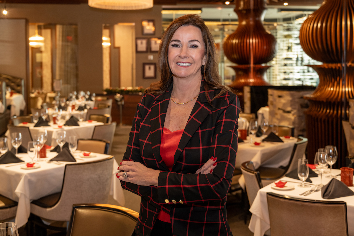 Dee Lincoln inside her namesake restaurant, Dee Lincoln Prime, embodying the confidence and legacy that earned her the title “Queen of Steaks.” | Photo by Kathy Tran