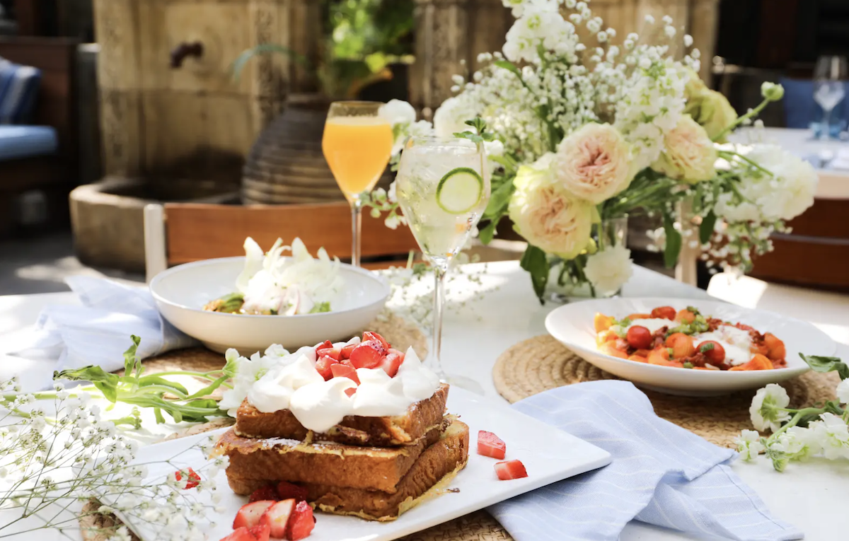 Sweet and savory brunch dishes with cocktails at Dolce Riviera. | Photo by Harwood Hospitality Group