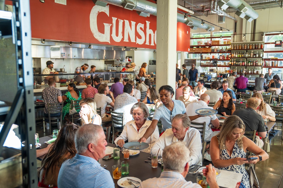 Gunshow - DiningOut The bustling dining room at Gunshow. | Photo by Blake Studwell