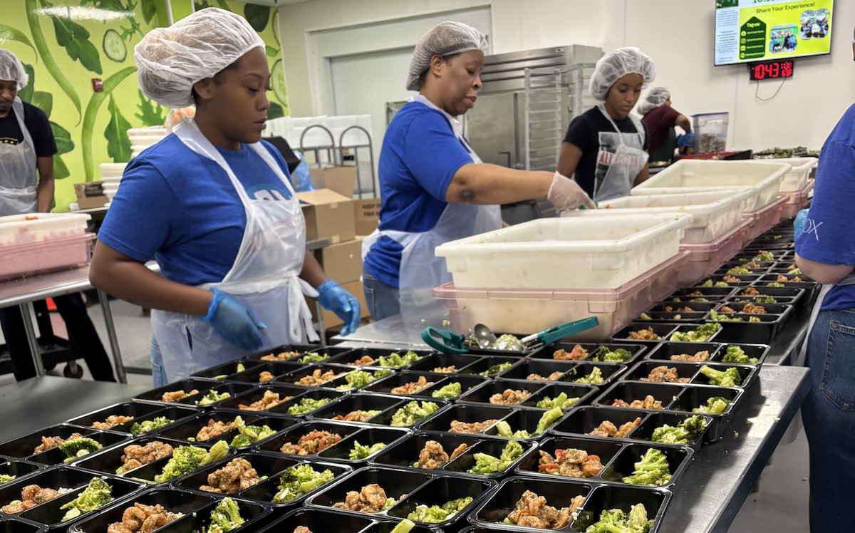Volunteers pack meals at Open Hand Atlanta. | Photo by Open Hand Atlanta