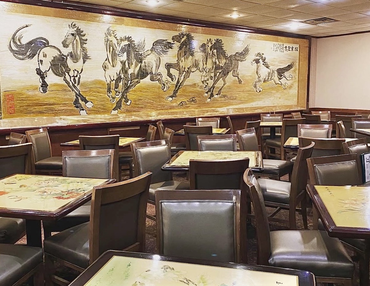 Vibrant wall art commands attention in the dining room at China Garden. | Photo by China Garden