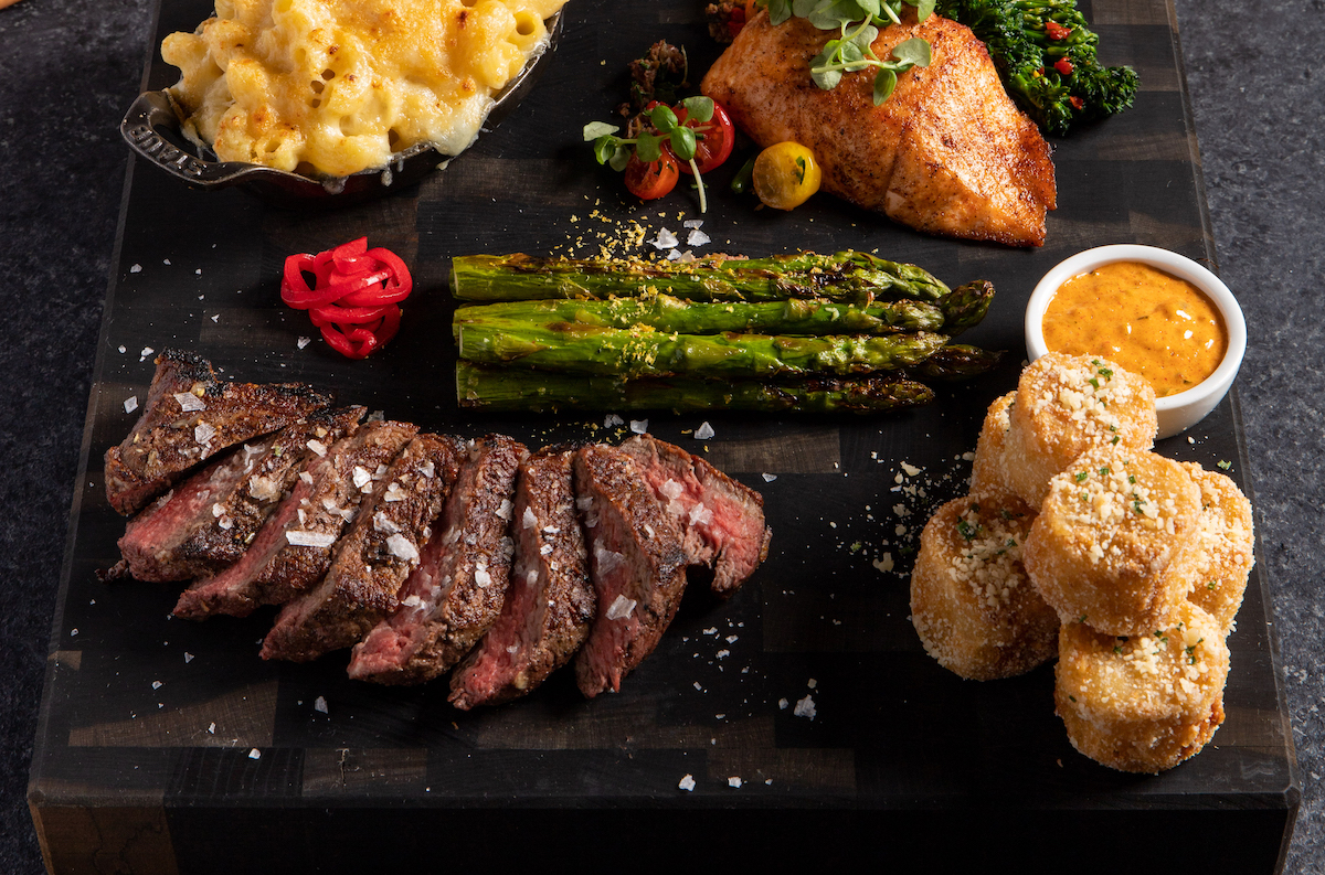 Steak, seafood, and sides at STK. | Photo by the One Group