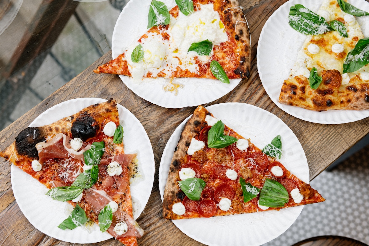 Slices of the L’Industrie Pie including the Burrata Pie, New Yorker Pie, and the White Pie. | Photo by Teddy Wolff
