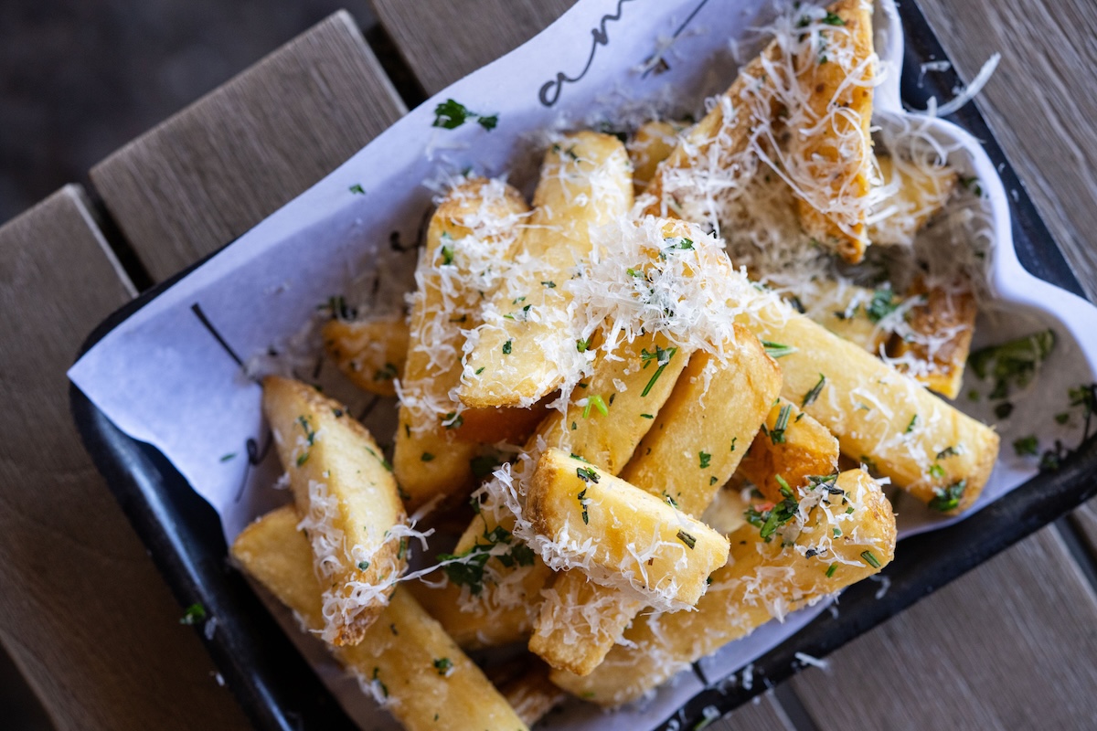 Don't skip the beef tallow fries. | Photo courtesy of Amelia’s by EATS