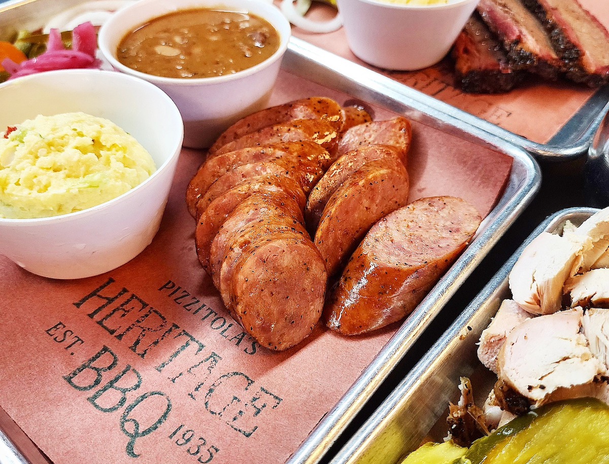 A tray of sliced sausage at Pizzitola’s Heritage BBQ showcases the pit-smoked tradition that’s defined the restaurant since 1935. | Photo by Pizzitola's Heritage BBQ