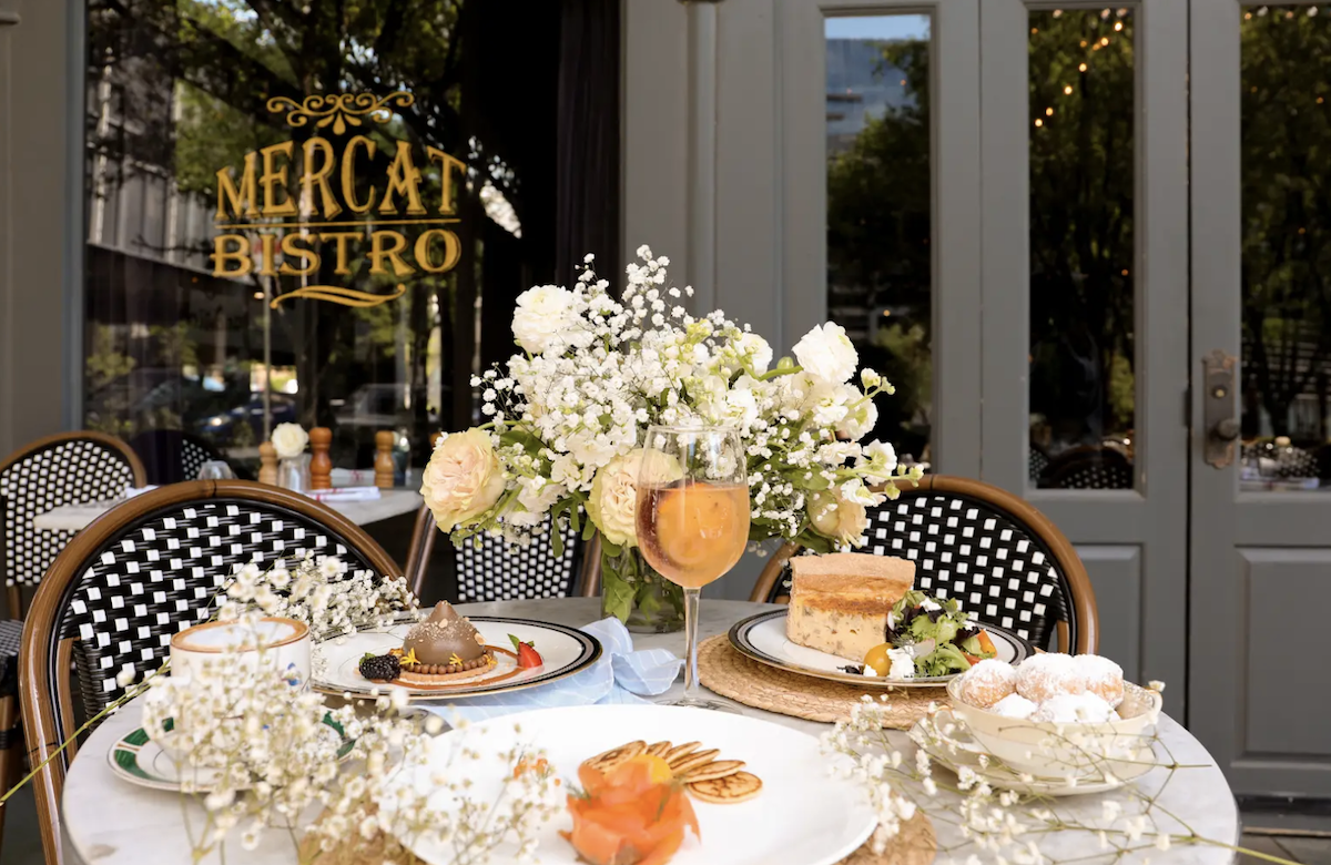 A festive table setting on the patio at Mercat Bistro. | Photo by Harwood Hospitality Group