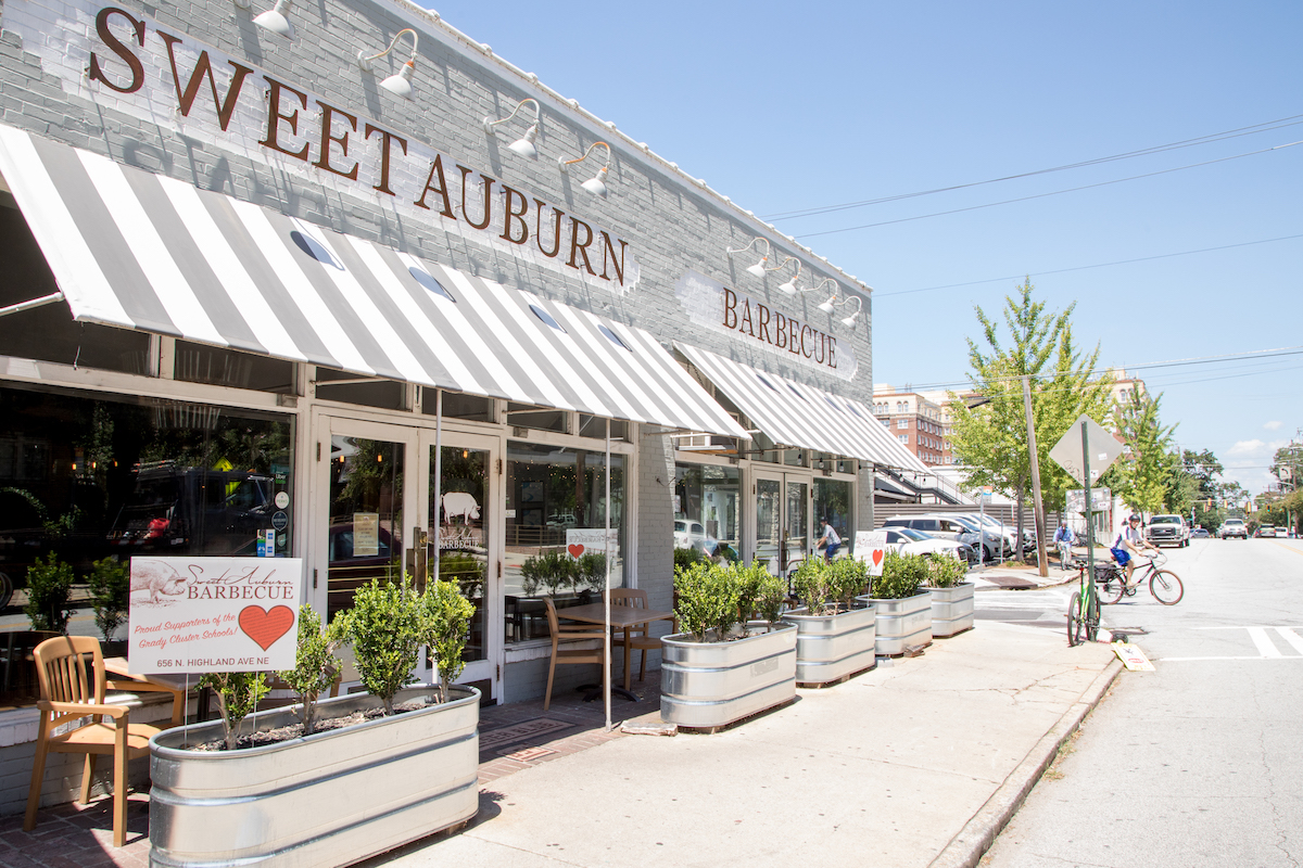 The entrance and sidewalk patio at Sweet Auburn BBQ. | Photo by Kate Blohm