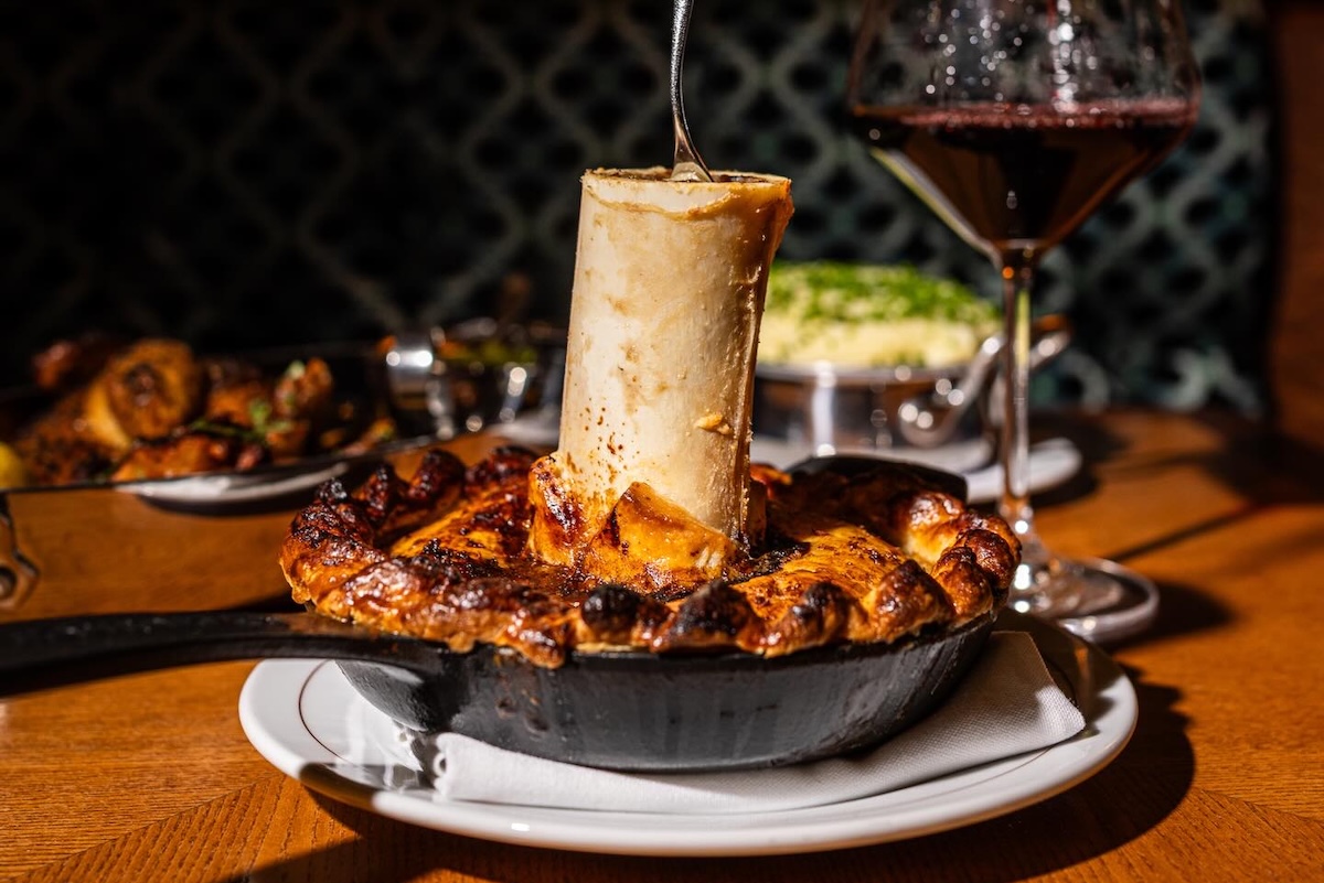 Elegance awaits at this NYC steakhouse, and so does this rich bone marrow appetizer. | Photo courtesy of The Dynamo Room
