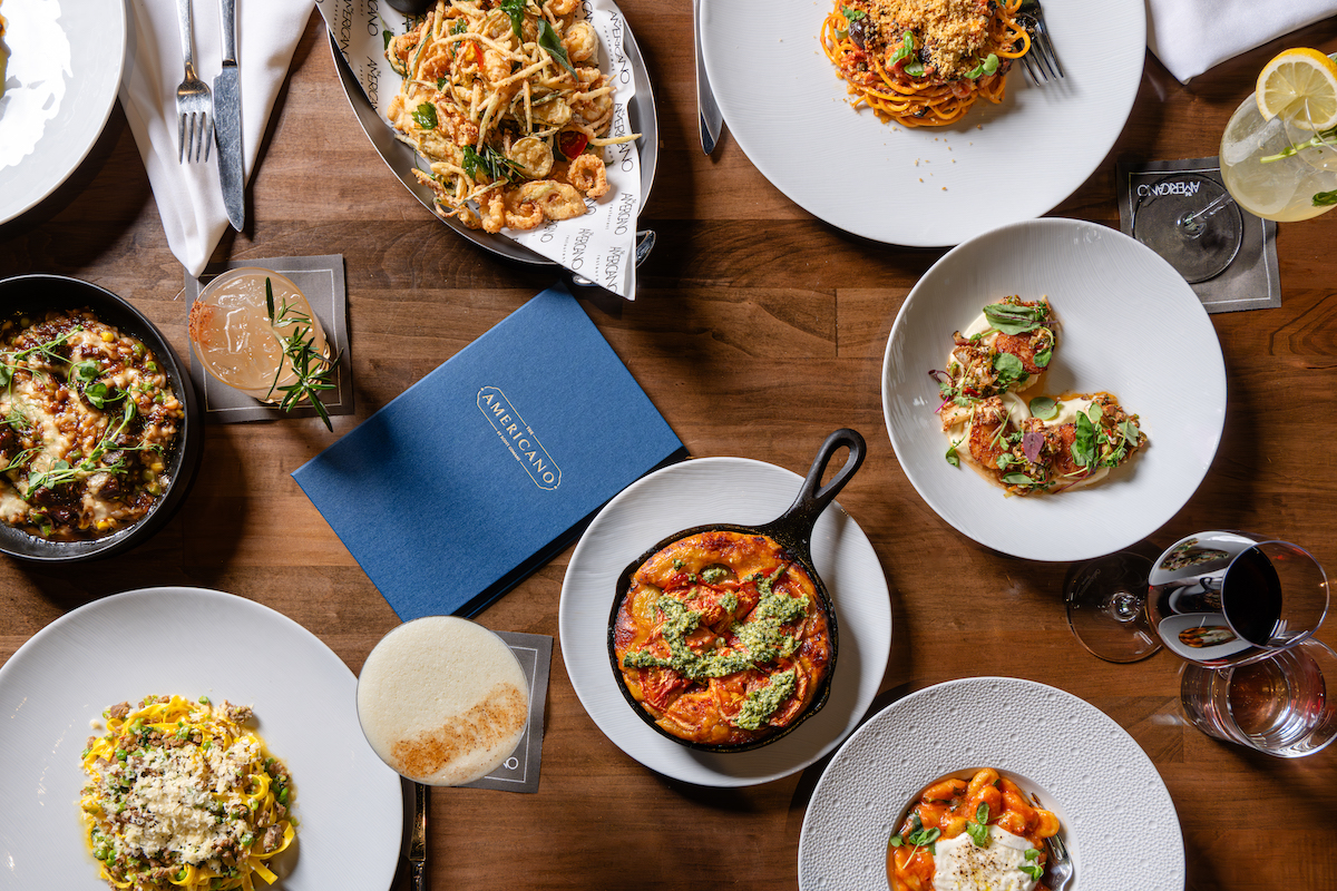 A spread of wine, cocktails, pastas, and other savory dishes at the Americano. | Photo by the Americano