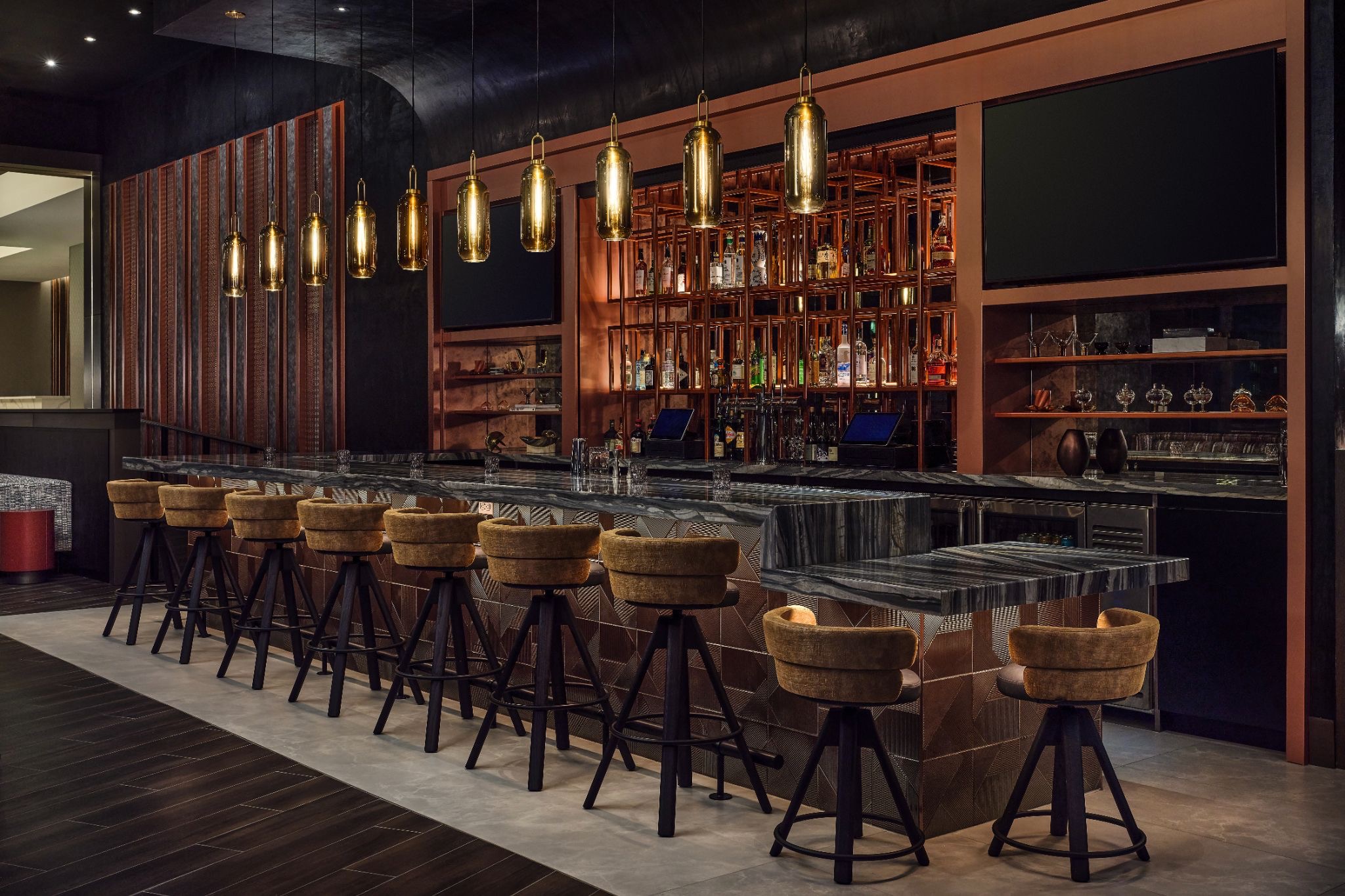 The beekeeper-themed bar is intimate and inviting | Photo by Apiary Hote