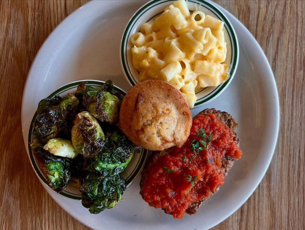 Southern comfort classics, like crispy Brussels sprouts, creamy mac and cheese, and meatloaf, make Paschal’s a standout stop inside Hartsfield-Jackson Atlanta International Airport. | Photo by Bantam + Biddy