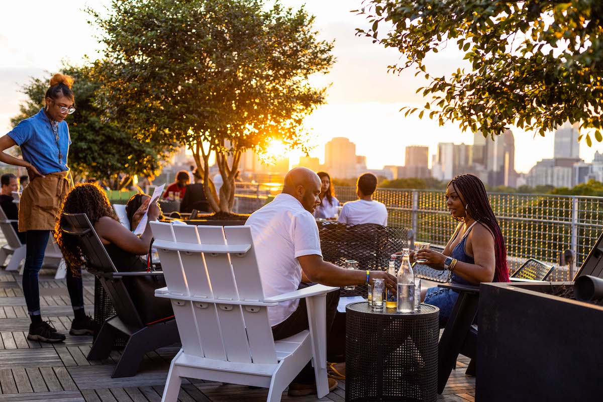 Guests enjoy sunset views at 9 Mile Station. | Photo by Slater Hospitality