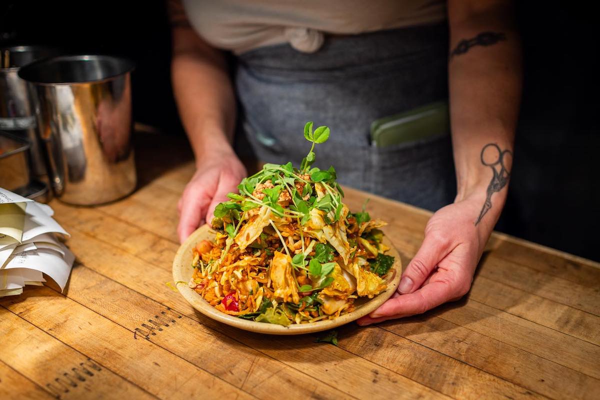 The crispy rice salad with fresh herbs and bold flavors make for the ultimate crunch in every bite at Talat Market. | Photo by Talat Market
