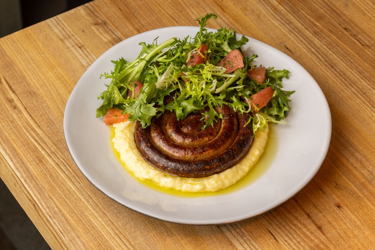DEN_Johnny_Bechamel_sausage - DiningOut Don't skip the Italian sausage with polenta. | Photo by Luke Gottlieb