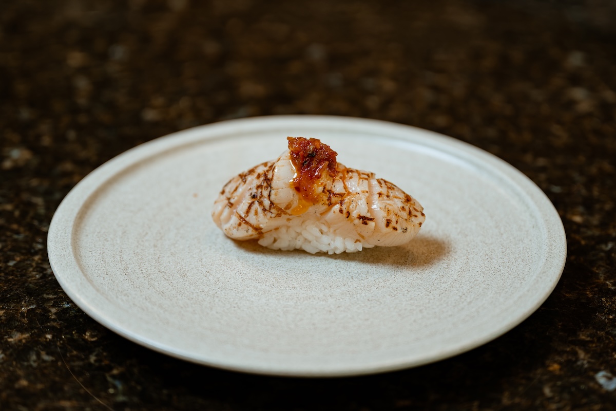 A perfect piece of seared Hokkaido scallop sushi. | Photo by Lucy Beaugard