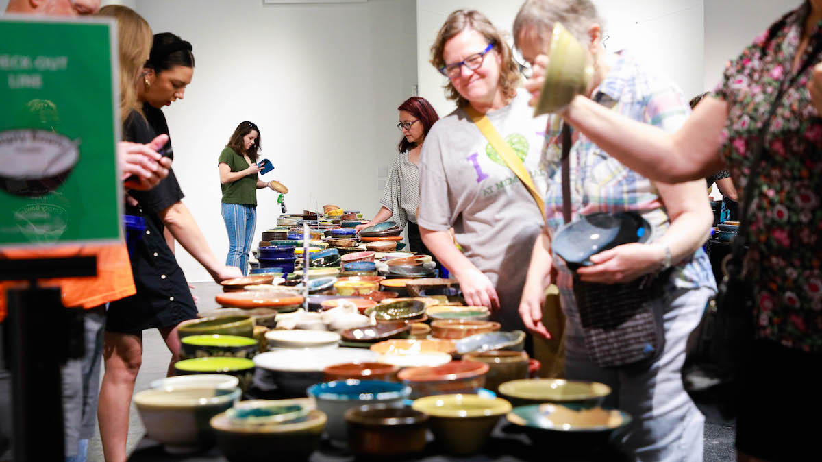Crowds peruse the large collection of handcrafted bowls at the Empty Bowls Houston fundraising event. | Photo by Empty Bowls Houston