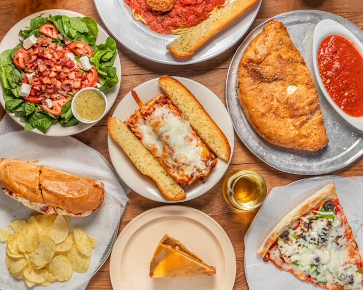 Pizzas by the slice, cazlzones, and other handhelds at Grant Central Pizza. | Photo by Grant Central Pizza