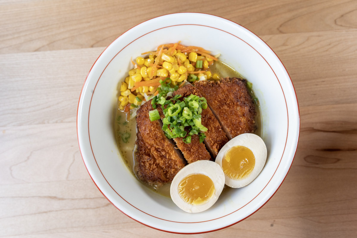 Yakitori Jinbei - DiningOut The katsu curry ramen at Yakitori Jinbei pairs crispy pork cutlet with a savory curry-infused broth. | Photo by Yakitori Jinbei