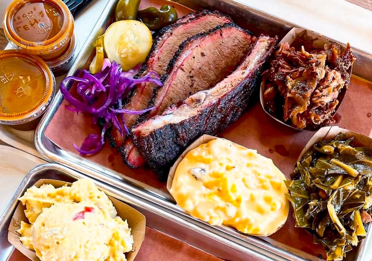 A tray loaded with brisket, ribs, pulled pork, and classic Southern sides showcases why Killen’s BBQ remains one of the Houston area’s top barbecue destinations. | Photo by Killen's BBQ