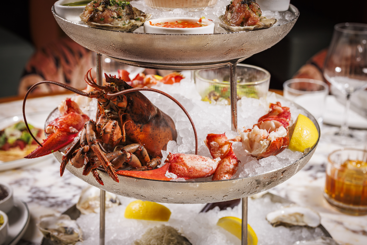 A towering seafood platter at Maroma leans into the restaurant’s coastal Mexican focus with lobster, oysters and chilled shellfish layered over ice alongside bright citrus and spicy accompaniments. | Photo by Samantha Marie Photography