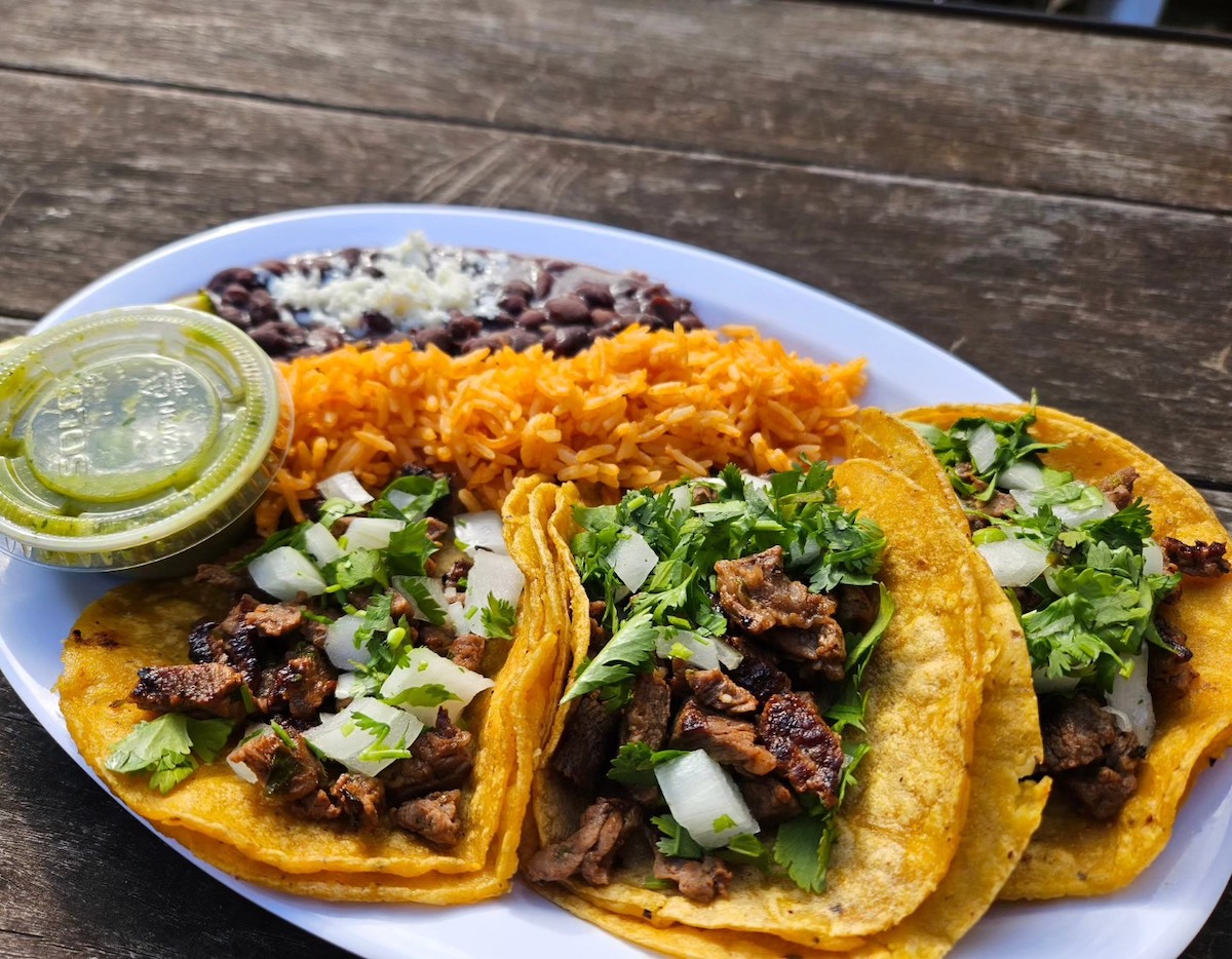 A trio of beef tacos with rice and beans at the Midway Pub. | Photo by the Midway Pub