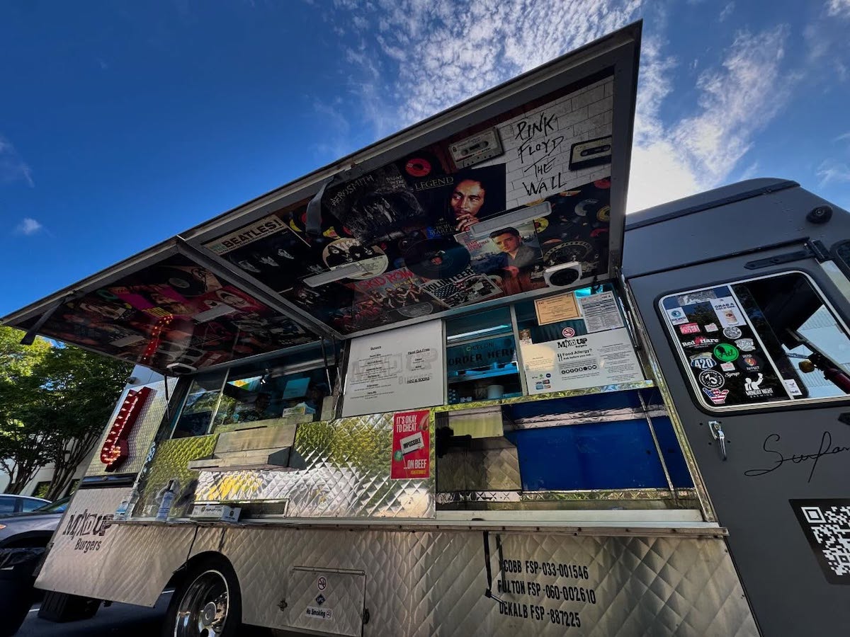 Music posters decorate the Mix’d Up Burgers food truck. | Photo by Mix’d Up Burgers