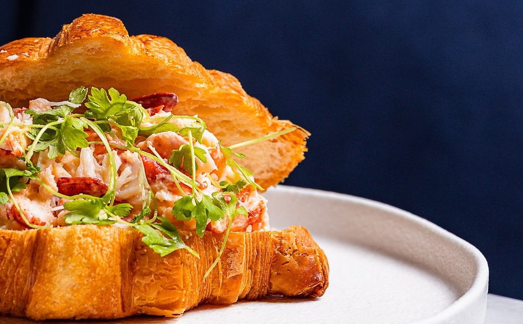 Chef London Chase makes this take on a lobster roll at Seventy Seven Alley . | Photo by Kyran John
