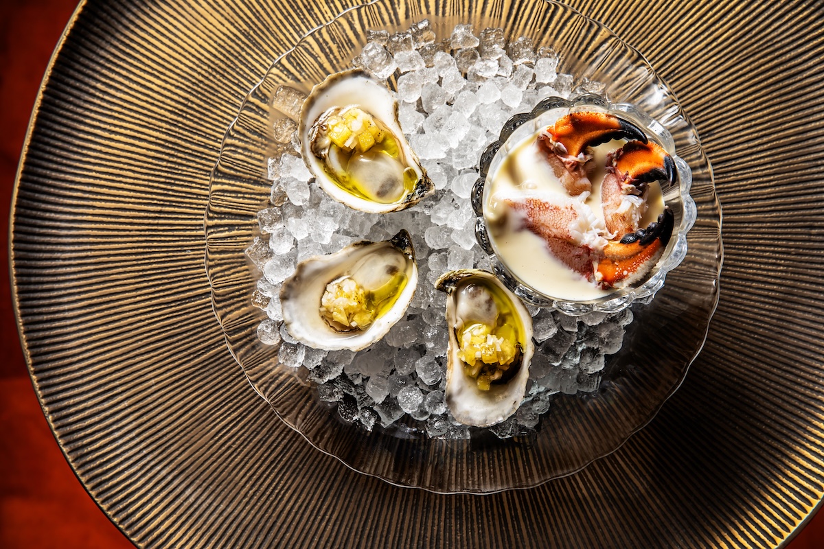 Jonah crab claws and oysters at Undercurrent. | Photo by Lizzie Munro