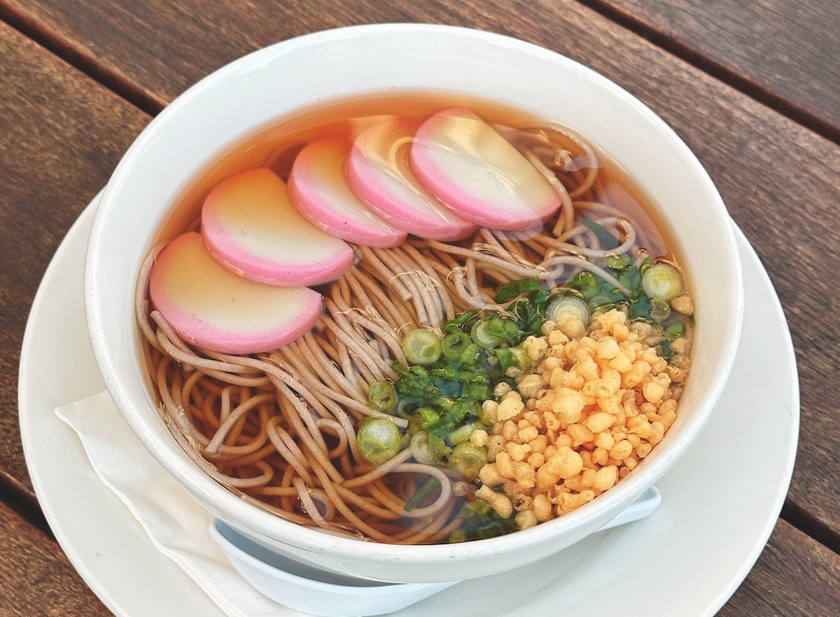 Buckwheat noodles in hot broth, kamaboko, negi, tenkasu at OK Yaki. | Photo by OK Yaki