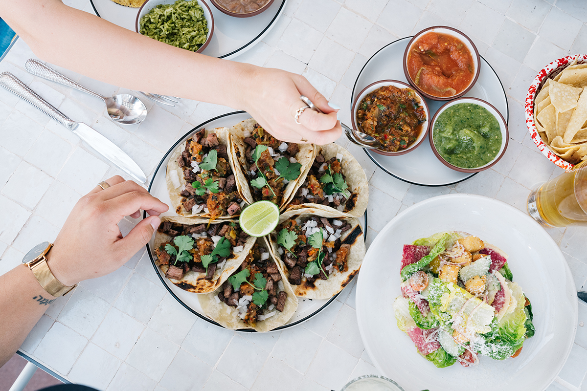 PHX_Glenrosa 1_Courtesy of Glenrosa - DiningOut The rich char of grilled carne asada served in house-made tortillas and topped with spicy salsas is complemented by the crisp, savory umami of a classic Tijuana Caesar Salad. | Photo courtesy of Glenrosa