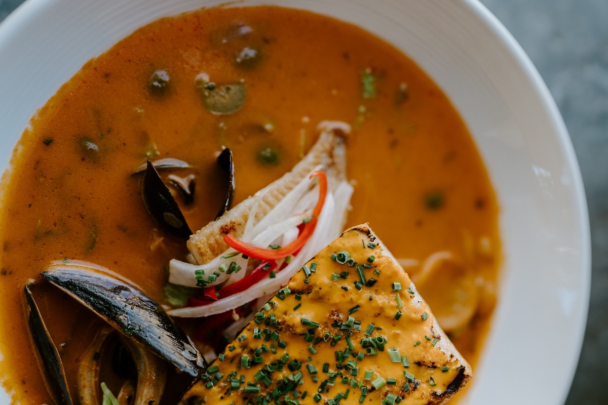 Caption: Zinc Bistro is known for its European café-like feel and traditional French cuisine like bouilabaisse. | Photo courtesy of Zinc Bistro. 