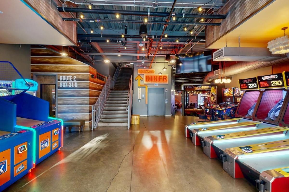 Punch Bowl Social at the Battery Atlanta combines arcade games, bowling, karaoke, and oversized cocktails under one roof. | Photo by Punch Bowl Social