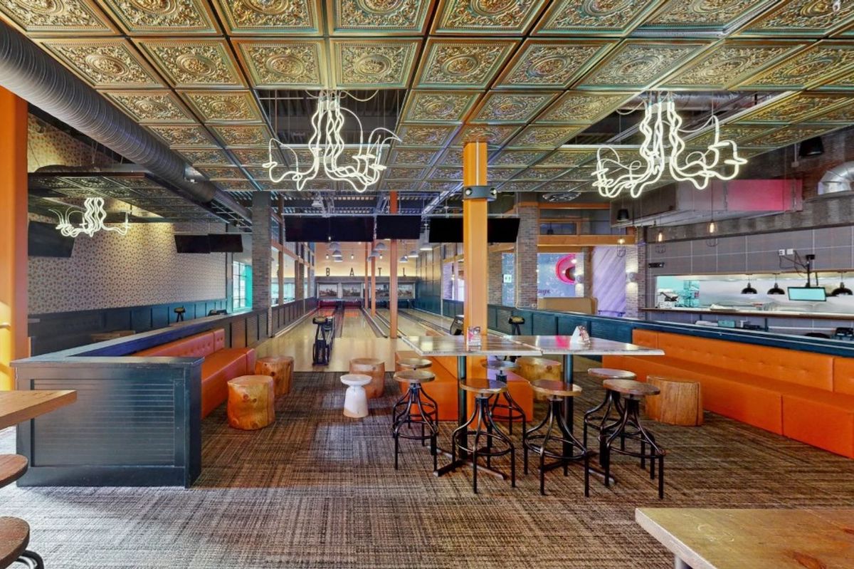 Bowling lanes and lounge seating give Punch Bowl Social its lively, group-friendly atmosphere near Truist Park. | Photo: Punch Bowl Social