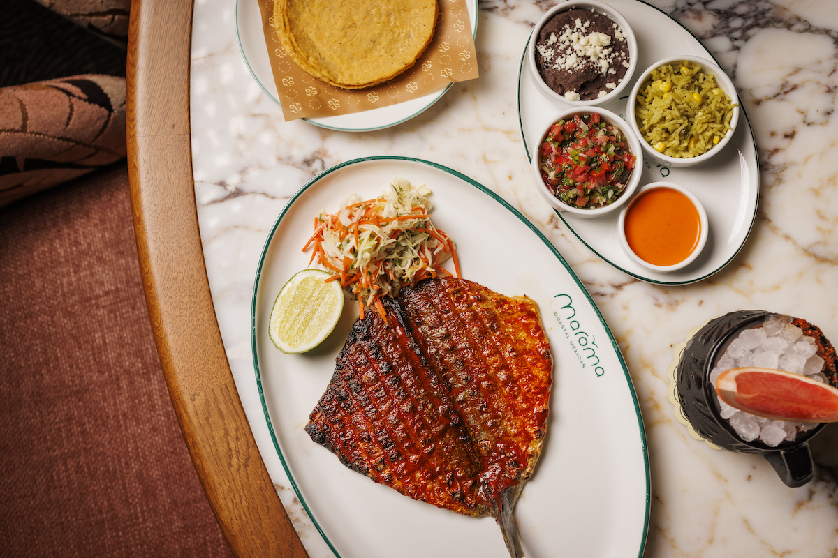 The sea bream a la talla at Maroma arrives lacquered in a smoky red chile marinade, grilled over mesquite and served with house-made tortillas, rice, beans and bright, crisp slaw. | Photo by Samantha Marie Photography