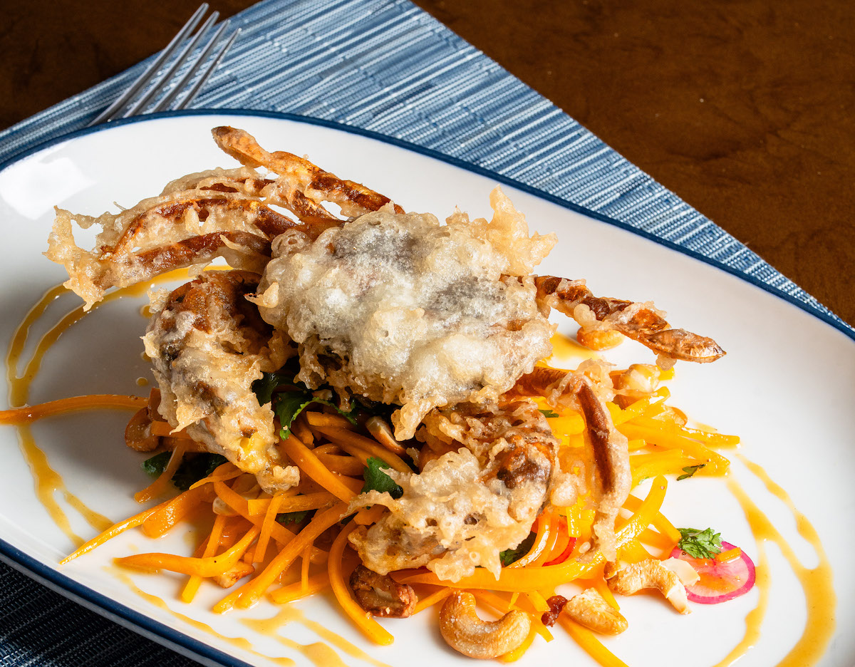 Latuli’s tempura-style soft shell crab arrives delicately crisp atop marinated butternut squash with crunchy cashews and bright, seasonal flavors. | Photo by Michael Anthony
