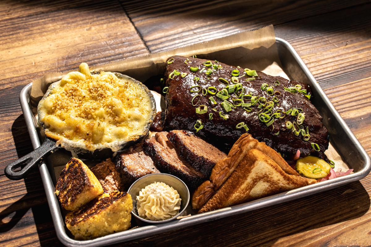 Smoked brisket, glossy ribs, cast-iron mac and cheese, and cornbread at  Sweet Auburn BBQ. | Photo by Jordan Marc