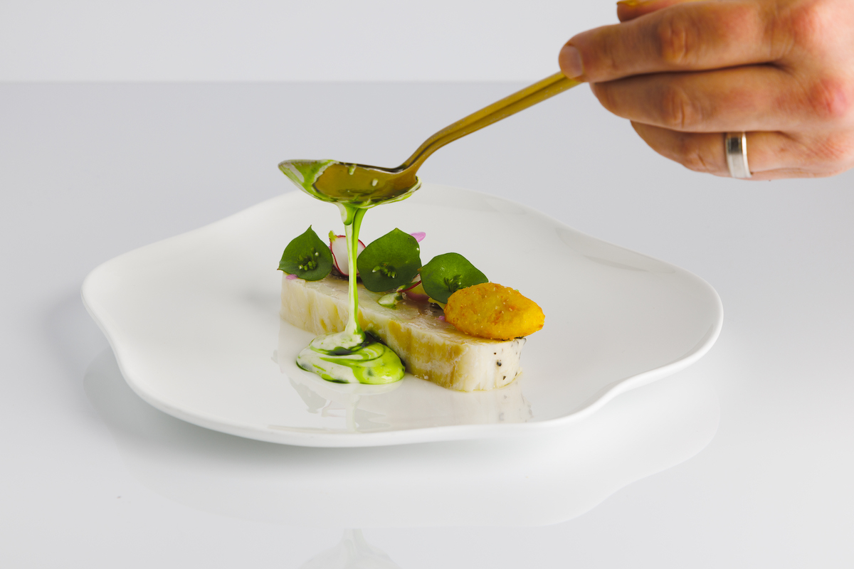 ATLAS - CHEF FREDDY MONEY - TURBOT Sea Greens Herb Sauce - PHOTO CREDIT - TOMAS ESPINOZA -1270 - DiningOut Turbot with sea greens and herb sauce, finished tableside at Atlas. | Photo by Tomas Espinoza