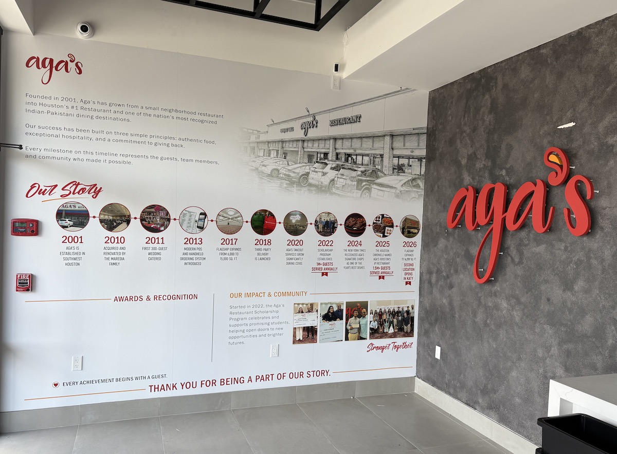 A timeline mural inside Aga's To Go highlights the restaurant's growth from a small Houston eatery founded in 2001 to one of the nation's most acclaimed Indian-Pakistani dining destinations. | Photo by Aga's Restaurant & Catering