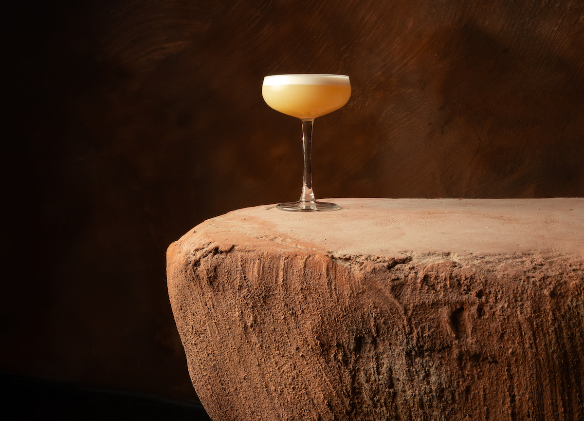 The Bandolero cocktail combines mezcal, Rhum Agricole JM, crème de cacao, mole spices, lime and chili oil, reflecting La Cueva’s focus on Latin-inspired flavors. | Photo by Lauren Lynn