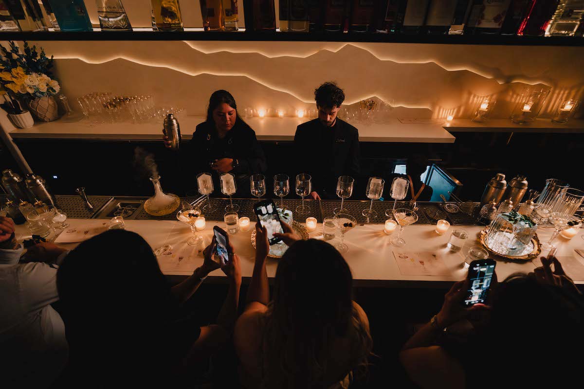 Guests gather around the 10-seat bar at the Arc Room, where cocktails are presented in a guided tasting format inspired by the omakase tradition. | Photo by Jason Haas