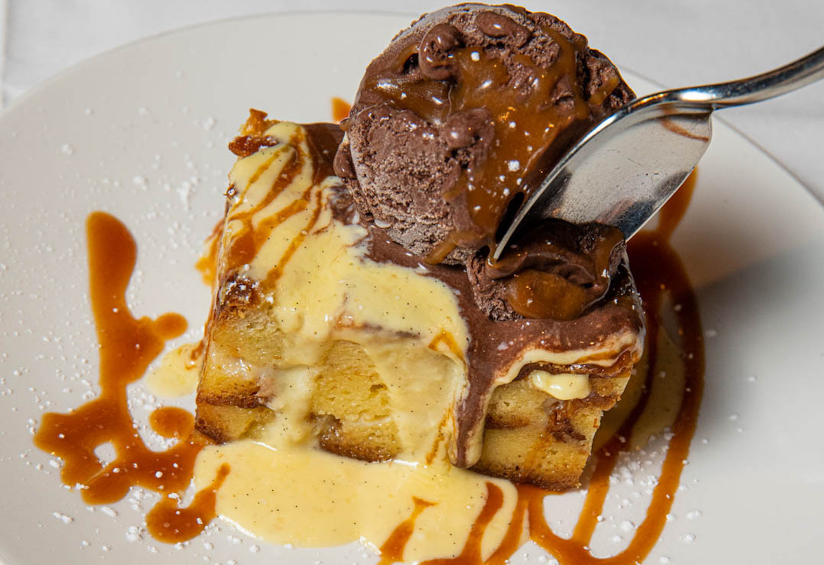Budino Valenza - DiningOut Valenza’s signature budino pairs warm white chocolate bread pudding with dark chocolate gelato for one of metro Atlanta’s most memorable Italian desserts. | Photo by Valenza