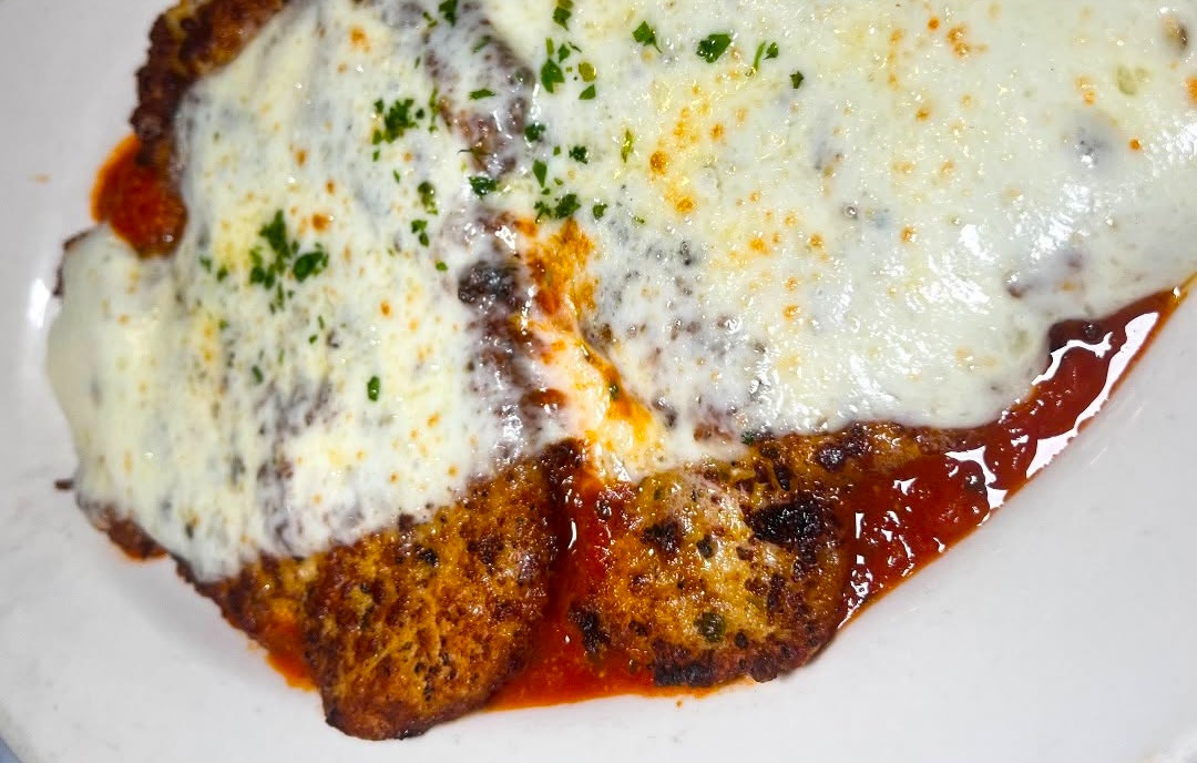 A classic red sauce chicken parm. | Photo courtesy of Carmine's